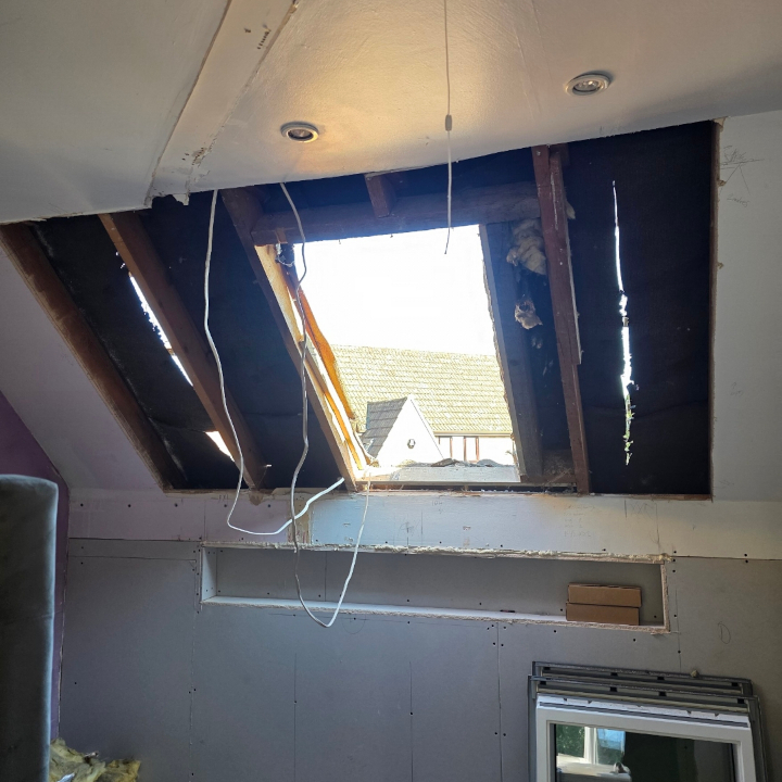 New roof window installation in attic